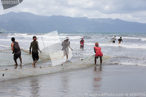 Image of Native Malagasy fishermen fishing on sea, Madagascar