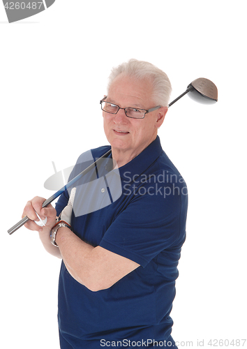 Image of Senior man standing with golf iron.