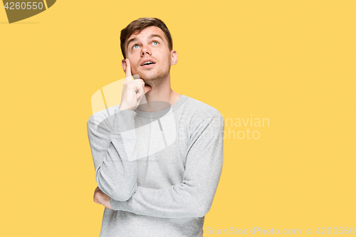 Image of The young man smiling and looking up