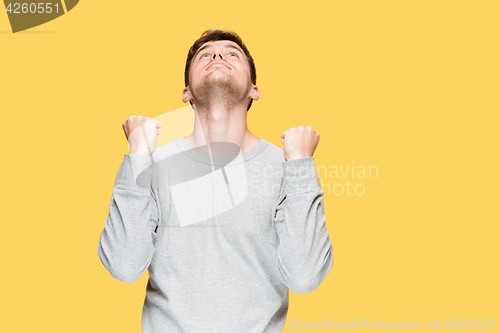 Image of The young man screaming with delight