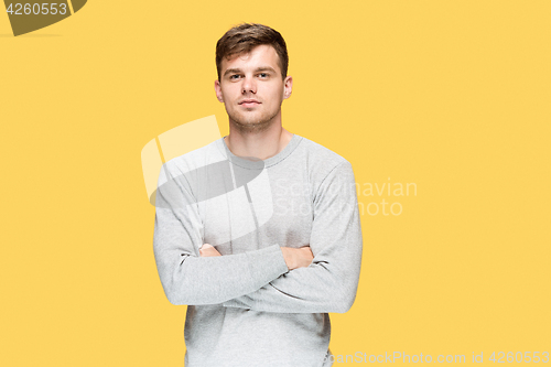 Image of The young man smiling and looking at camera