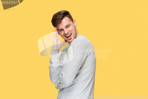 Image of The young man smiling and looking away