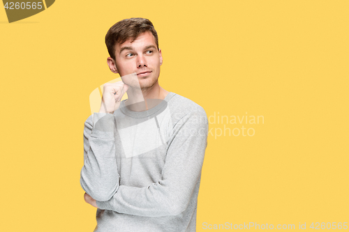 Image of The young man smiling and looking away