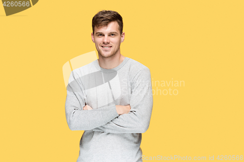 Image of The young man smiling and looking at camera