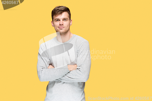 Image of The young man smiling and looking at camera
