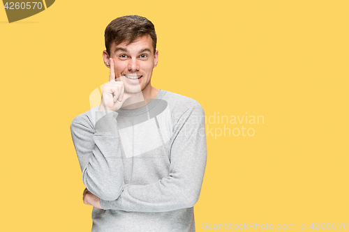 Image of The young man smiling and looking at camera