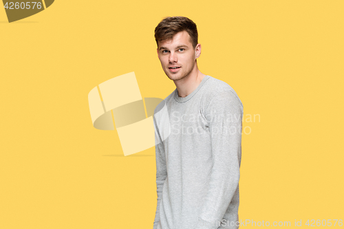 Image of The young man smiling and looking at camera
