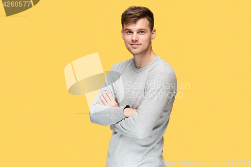 Image of The young man smiling and looking at camera