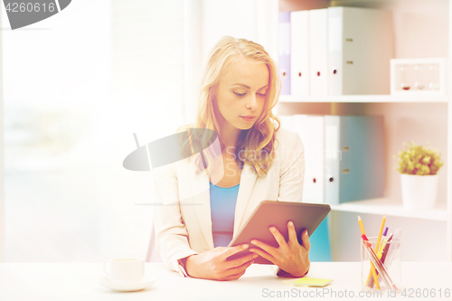 Image of businesswoman or student with tablet pc at office