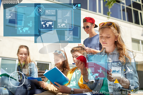 Image of group of students with notebooks at school yard