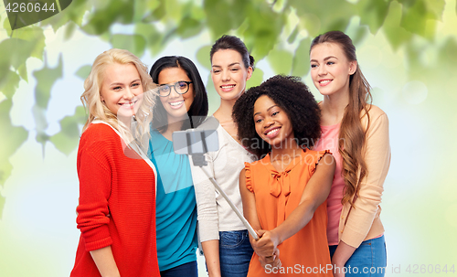 Image of international group of happy women taking selfie