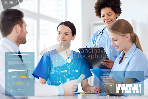 Image of group of happy doctors meeting at hospital office
