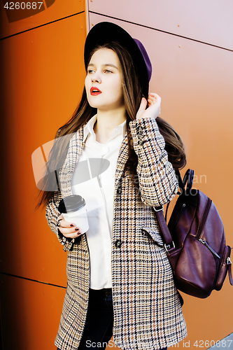 Image of young pretty hipster girl student with coffee cup posing adorable smiling, lifestyle people concept outdoor