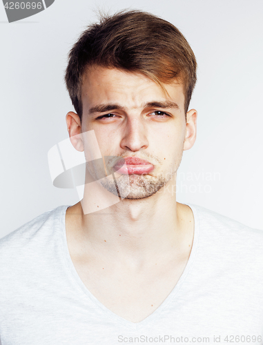 Image of young handsome teenage hipster guy posing emotional, happy smiling against white background isolated, lifestyle people concept 