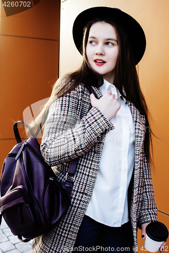 Image of young pretty hipster girl student with coffee cup posing adorable smiling, lifestyle people concept outdoor