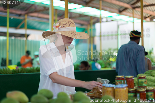 Image of Traveler shopping on traditional Victoria food market, Seychelles.