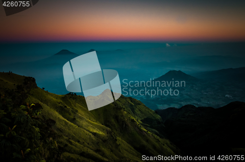 Image of Stratovolcano and mountains in morning fog