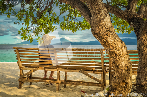 Image of Woman on bench