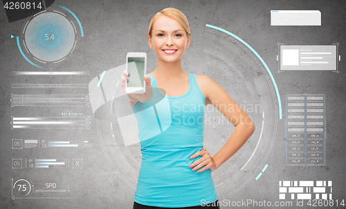 Image of smiling sporty woman with smartphone