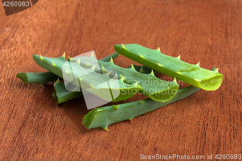 Image of aloe vera fresh leaf on wooden table