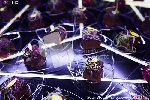 Image of Beautifully decorated catering banquet table with different food snacks.