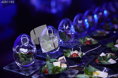 Image of Beautifully decorated catering banquet table with different food snacks.