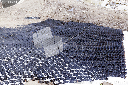 Image of fence for sand, close-up