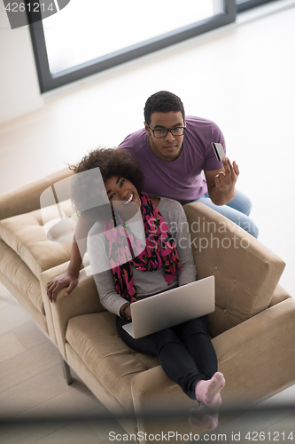 Image of african american couple shopping online