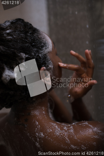 Image of African American woman in the shower