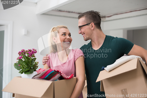 Image of young couple moving into a new home