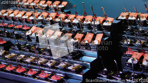 Image of Beautifully decorated catering banquet table with different food snacks.