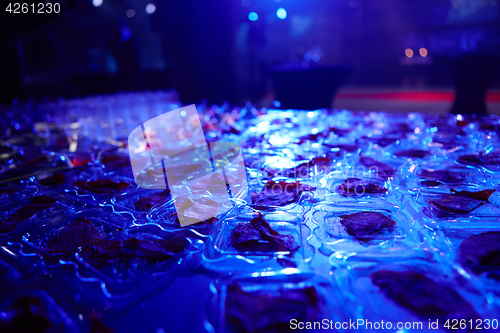 Image of Beautifully decorated catering banquet table with different food snacks.