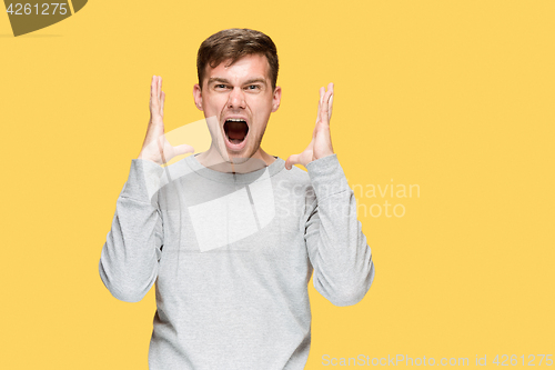 Image of The young man screaming with delight