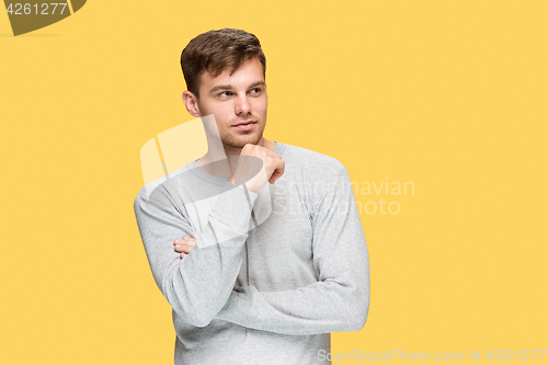 Image of The young man smiling and looking away