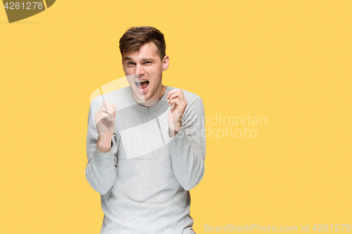 Image of The young man screaming with delight