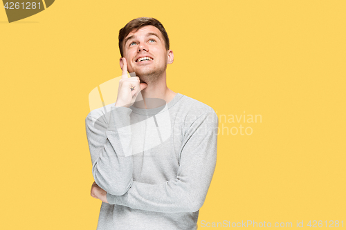 Image of The young man smiling and looking up