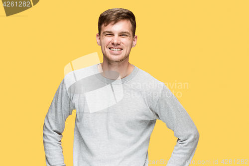 Image of The young man smiling and looking at camera