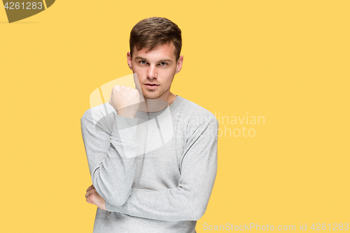 Image of The young man with a raised fist