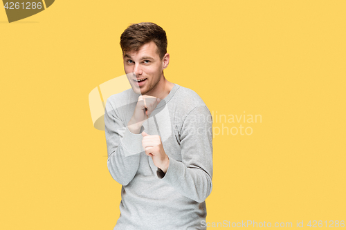 Image of The young man with a raised fist