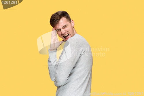 Image of The young man screaming with delight