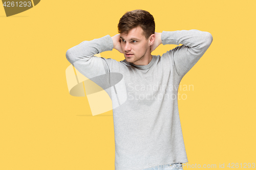 Image of The young man smiling and looking away