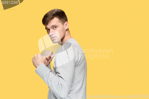 Image of The young man with a raised fist