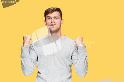 Image of The young man with a raised fist