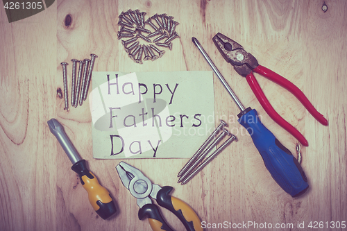 Image of Set of different tools on wooden background