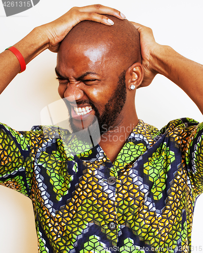 Image of portrait of young handsome african man wearing bright green nati