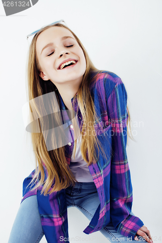 Image of young pretty teenage hipster girl posing emotional happy smiling on white background, lifestyle people concept 