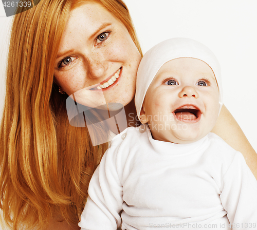 Image of young beauty mother with baby, red head happy family isolated close up