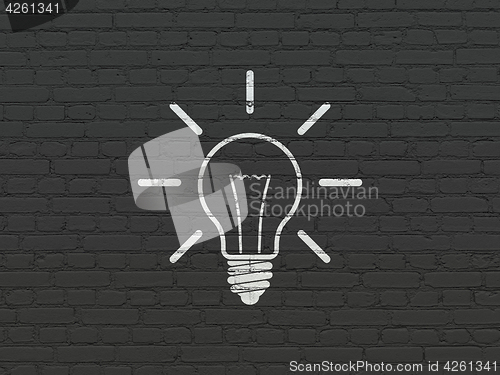 Image of Business concept: Light Bulb on wall background