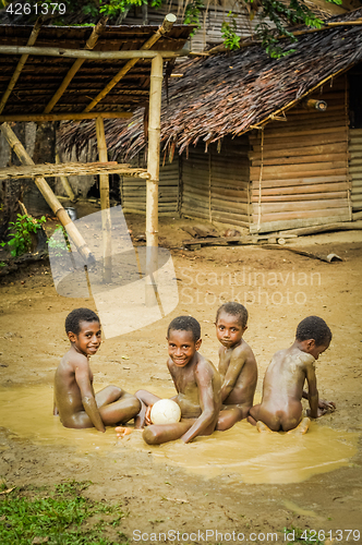 Image of Naked boys in mud