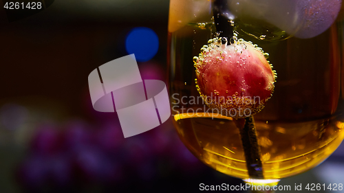 Image of Grapes floating in champagne creating lots of bubbles